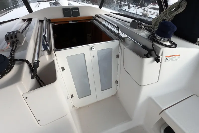 Moon Shadow Yacht Photos Pics 2013 Marlow-Hunter e33 sailboat cockpit with open cabin doors.