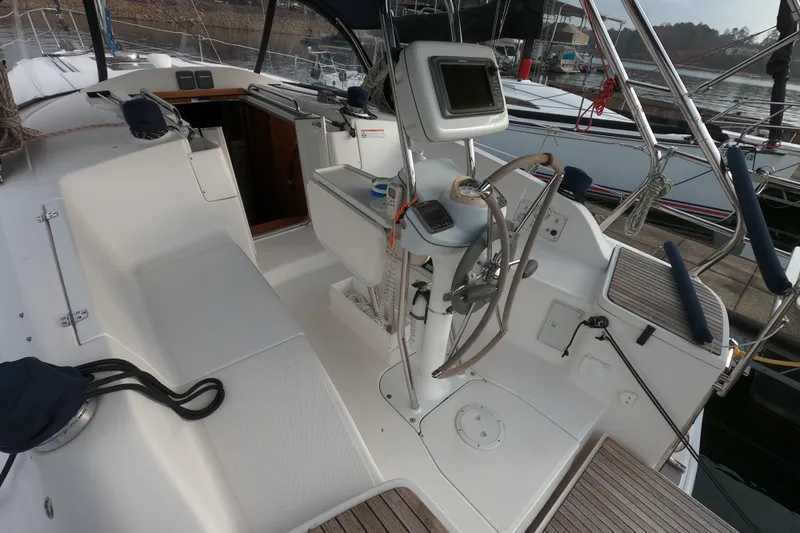 Moon Shadow Yacht Photos Pics 2013 Marlow-Hunter e33 sailboat cockpit with steering wheel and navigation equipment.