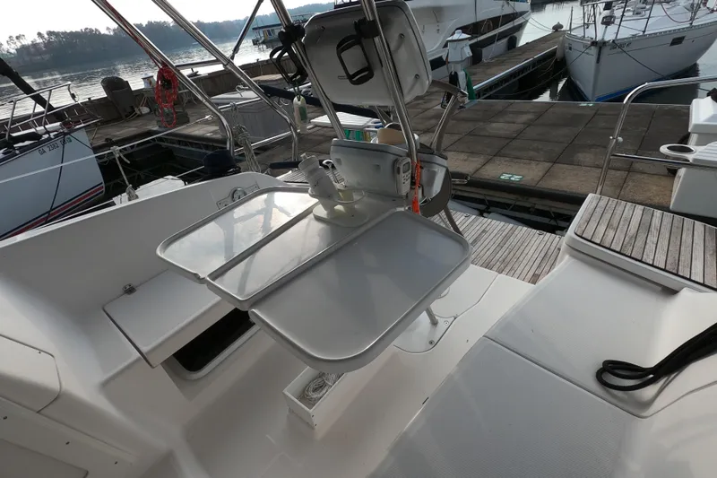 Moon Shadow Yacht Photos Pics Cockpit of 2013 Marlow-Hunter e33 sailboat with folding table and marina view.