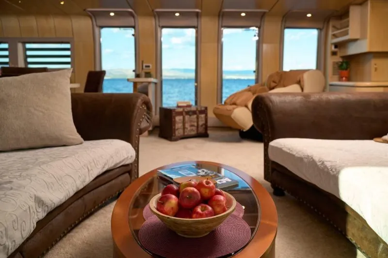  Yacht Photos Pics Luxurious interior of 1992 Posillipo Technema 82 yacht with sea view and cozy seating.