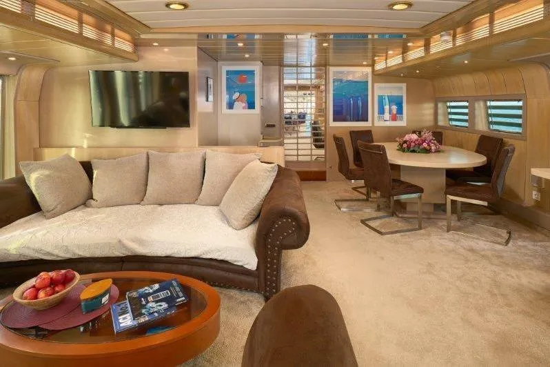  Yacht Photos Pics Luxurious interior of 1992 Posillipo Technema 82 yacht with elegant seating and dining area.