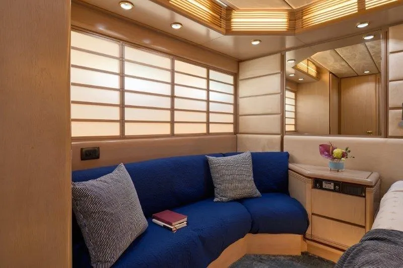  Yacht Photos Pics Luxurious interior of 1992 Posillipo Technema 82 yacht with blue seating and elegant decor.