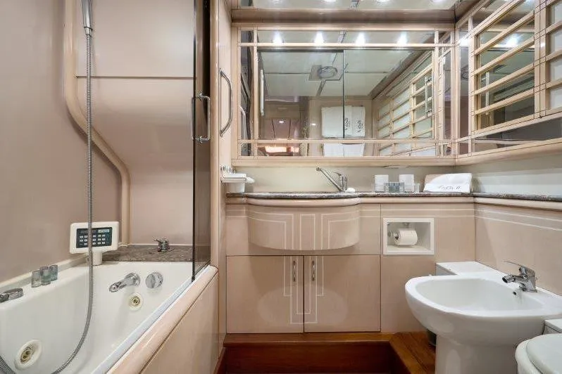  Yacht Photos Pics Luxurious bathroom interior on a 1992 Posillipo Technema 82 yacht, featuring elegant fixtures and a bathtub.