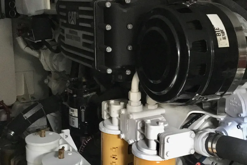 "journeys" Yacht Photos Pics Engine room of 2008 Grand Banks 59 Aleutian RP yacht, featuring CAT marine engine components.