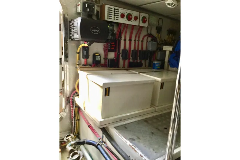 "journeys" Yacht Photos Pics Engine room of 2008 Grand Banks 59 Aleutian RP with electrical panels and storage.