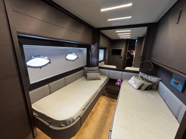  Yacht Photos Pics Luxurious interior of 2019 Pershing 74 yacht with twin beds and modern decor.