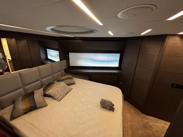  Yacht Photos Pics Luxurious bedroom interior of 2019 Pershing 74 yacht with modern design and elegant furnishings.
