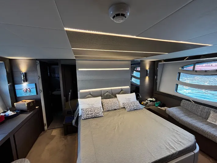  Yacht Photos Pics Luxurious bedroom interior of 2019 Pershing 74 yacht with modern design and ocean view.
