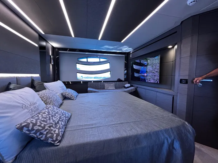  Yacht Photos Pics Luxurious interior of 2019 Pershing 74 yacht with modern bedroom and sleek design.