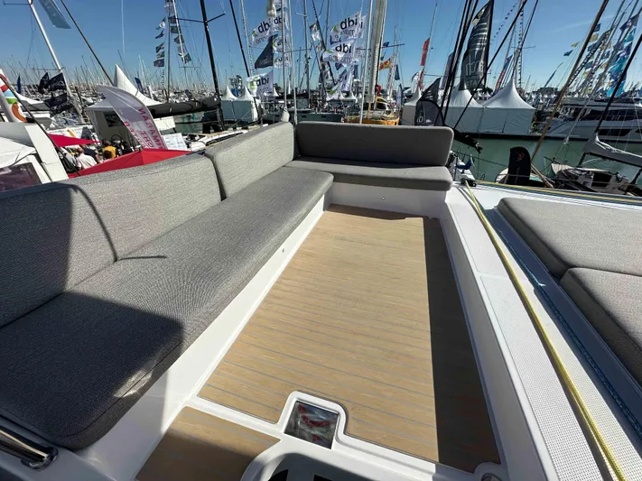  Yacht Photos Pics Luxurious seating area on 2025 NEEL 52 trimaran at a boat show.