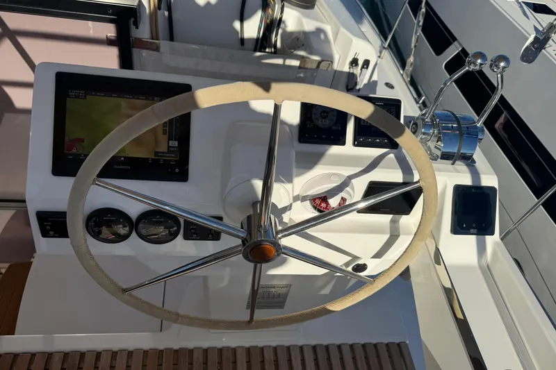  Yacht Photos Pics Steering wheel and controls of 2024 Fountaine Pajot Tanna 47 yacht.