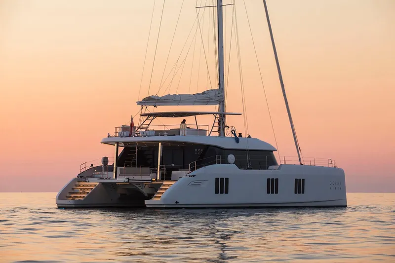  Yacht Photos Pics Luxury Sunreef 70 catamaran sailing at sunset, 2026 model.