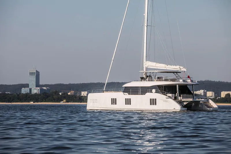  Yacht Photos Pics Luxury Sunreef 70 yacht sailing near city skyline, 2026 model.