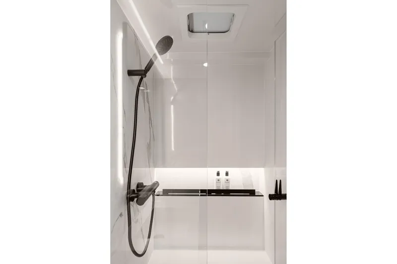  Yacht Photos Pics Luxurious shower area in 2026 Sunreef 70 yacht, featuring sleek modern design.