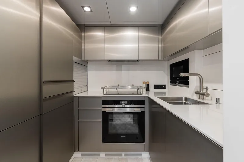 Yacht Photos Pics Modern kitchen in 2026 Sunreef 70 yacht with sleek stainless steel design.