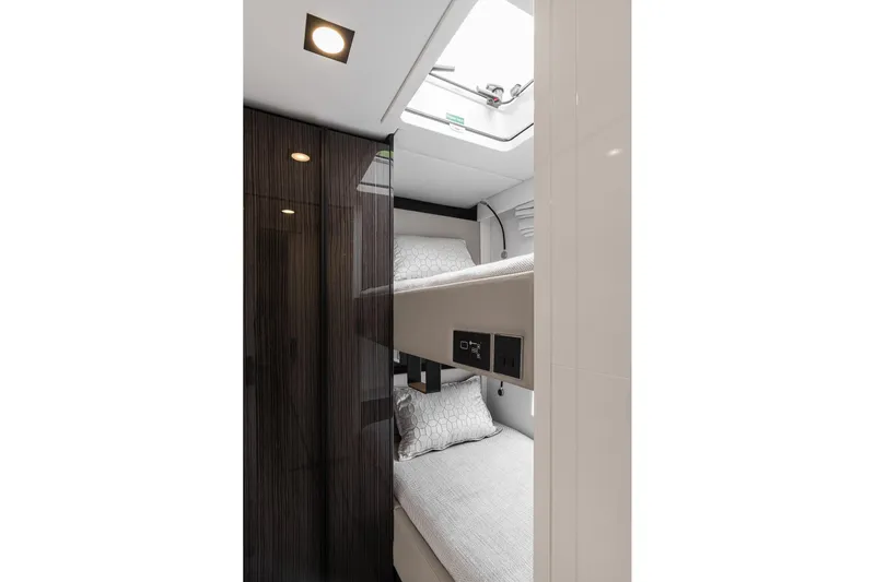  Yacht Photos Pics 2026 Sunreef 70 yacht interior with modern bunk beds and sleek design.