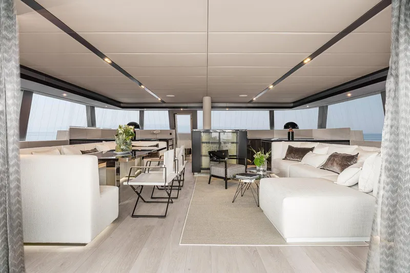  Yacht Photos Pics Luxurious interior of 2026 Sunreef 70 yacht, featuring elegant seating and modern decor.