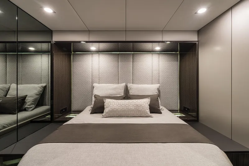  Yacht Photos Pics Luxurious bedroom interior on 2026 Sunreef 70 yacht, featuring modern design and elegant bedding.