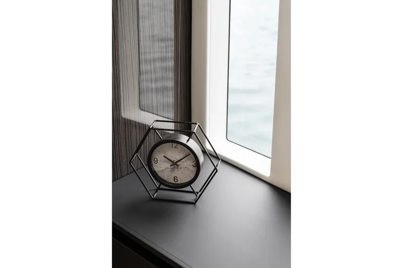  Yacht Photos Pics Modern clock on Sunreef 70 yacht interior, 2026 model, near window with ocean view.
