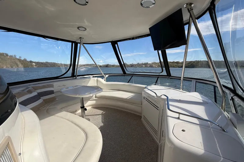 Gusto Yacht Photos Pics Luxurious 2003 Sea Ray 560 Sedan Bridge interior with panoramic water views.