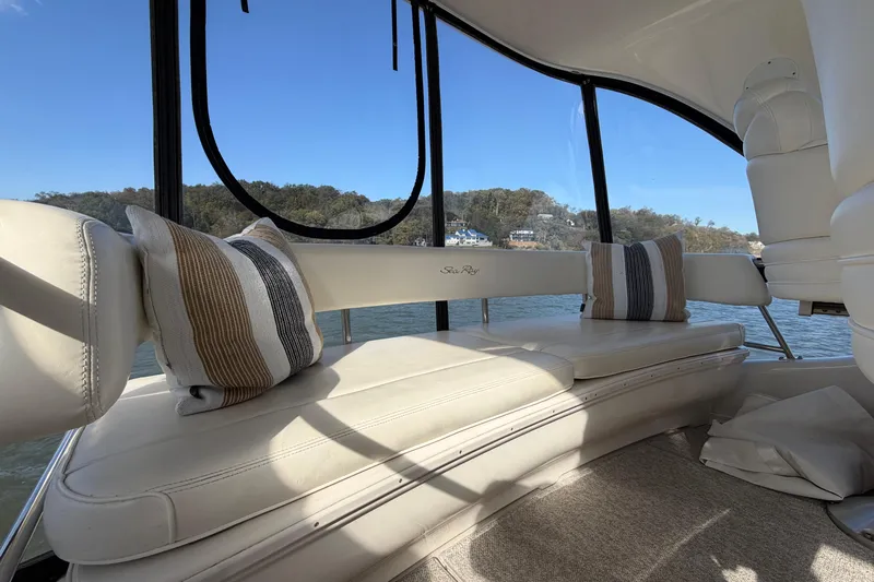 Gusto Yacht Photos Pics Luxurious interior of 2003 Sea Ray 560 Sedan Bridge with plush seating and scenic view.