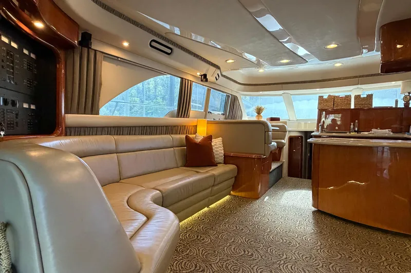 Gusto Yacht Photos Pics Luxurious interior of a 2003 Sea Ray 560 Sedan Bridge yacht with elegant seating and wood finishes.