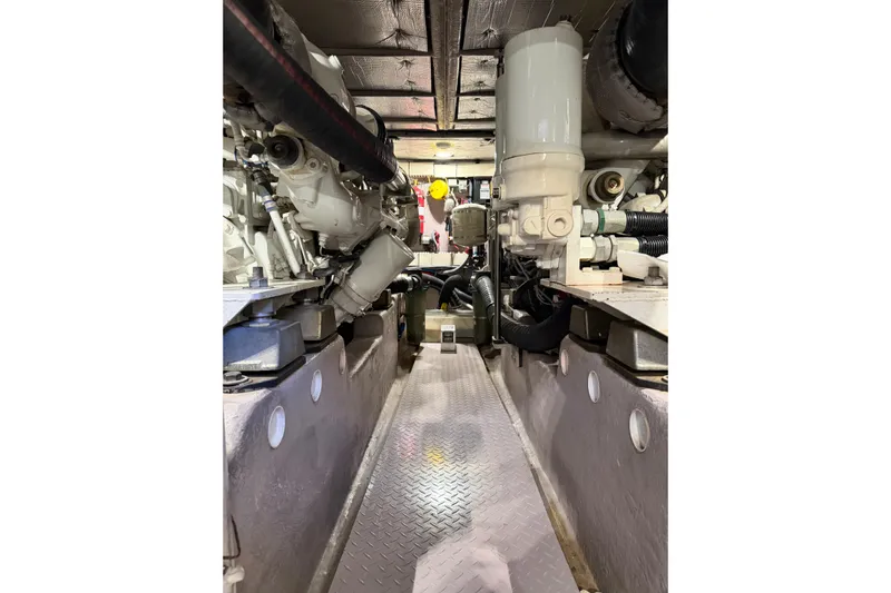 Gusto Yacht Photos Pics Engine room of 2003 Sea Ray 560 Sedan Bridge yacht, showcasing mechanical components.