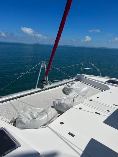 Nice Aft Too Yacht Photos Pics 2018 Leopard 45 catamaran on open sea with clear blue skies.