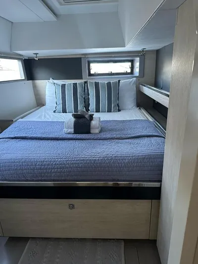 Nice Aft Too Yacht Photos Pics Luxurious bedroom interior of 2018 Leopard 45 yacht with cozy bedding and modern design.