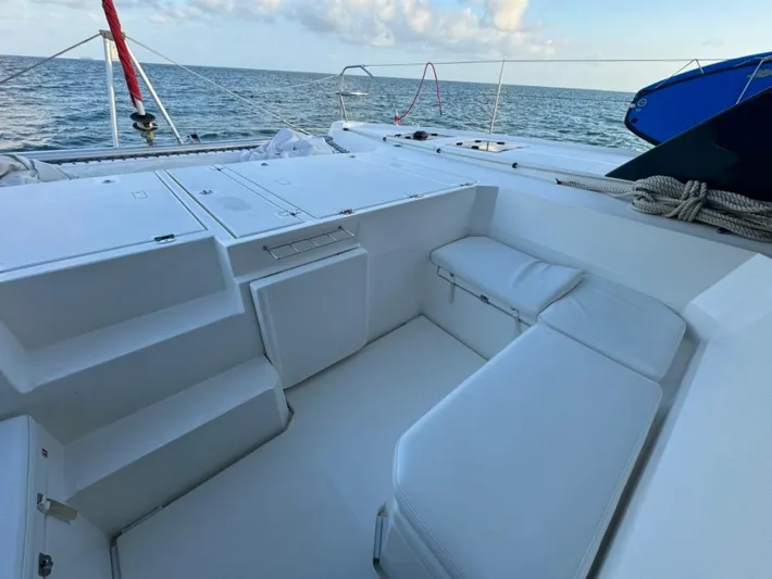 Nice Aft Too Yacht Photos Pics Spacious deck of 2018 Leopard 45 catamaran with white seating, ocean view.