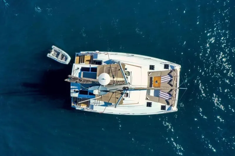 Dreamer Yacht Photos Pics Aerial view of 2022 Bali 4.6 catamaran on blue ocean water.