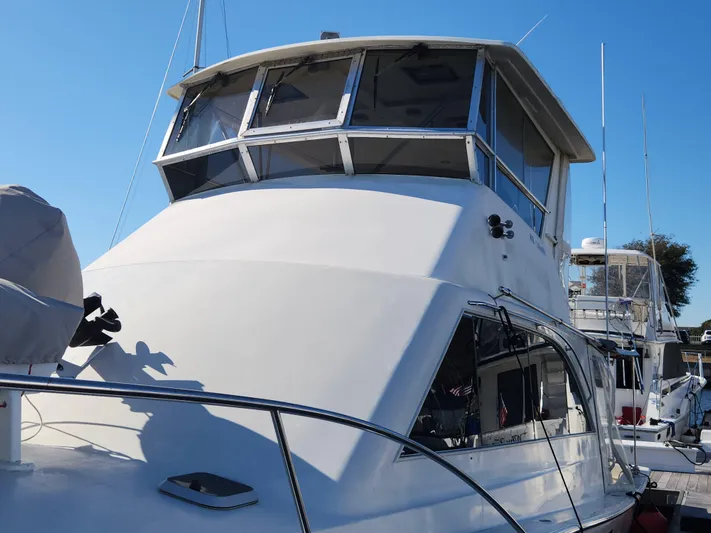 Boss Lady Yacht Photos Pics 2001 Ocean Yachts 48 model boat docked at a marina.