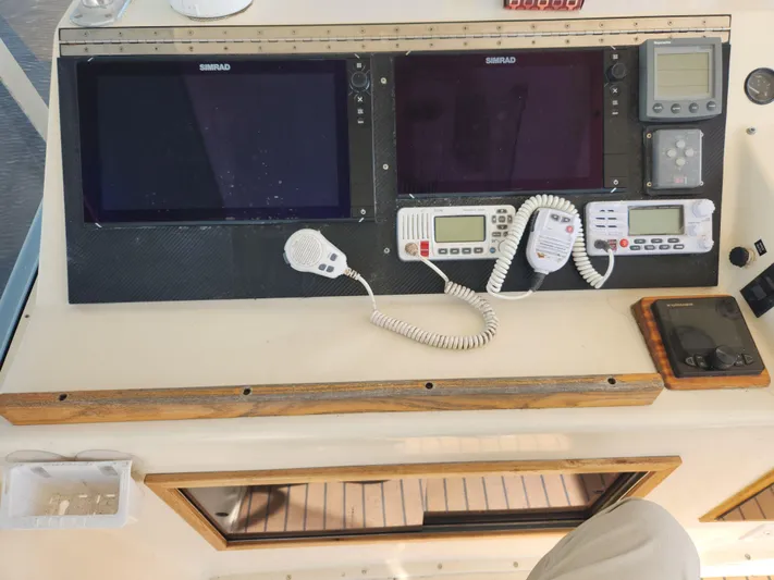 Boss Lady Yacht Photos Pics Control panel of a 2001 Ocean Yachts 48 with navigation and communication equipment.
