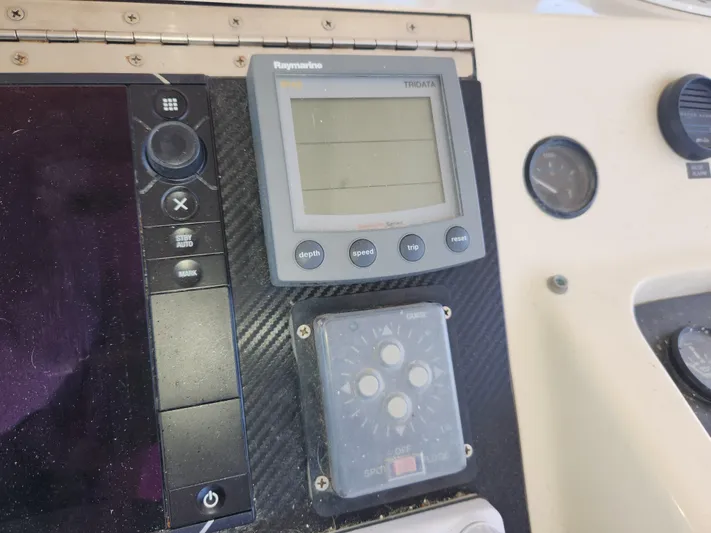 Boss Lady Yacht Photos Pics Control panel of a 2001 Ocean Yachts 48 with Raymarine Tridata display.