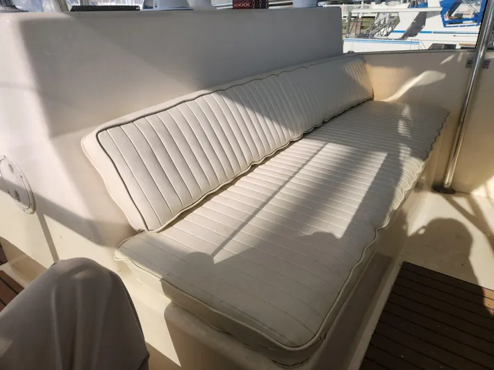 Boss Lady Yacht Photos Pics White cushioned seating on a 2001 Ocean Yachts 48 boat.