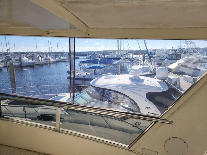 Boss Lady Yacht Photos Pics View from 2001 Ocean Yachts 48, overlooking marina with various boats docked.