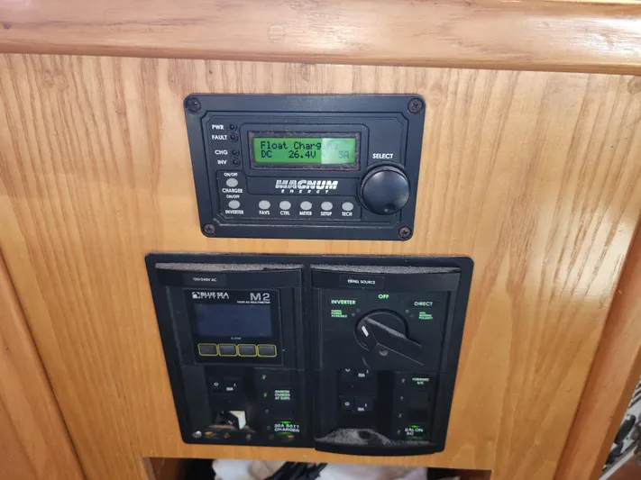 Boss Lady Yacht Photos Pics Control panel of a 2001 Ocean Yachts 48, featuring Magnum Energy and Blue Sea Systems.