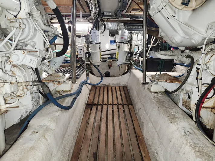 Boss Lady Yacht Photos Pics Engine room of a 2001 Ocean Yachts 48, showcasing mechanical components and piping.