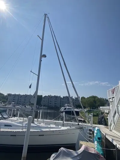 Axis Mundi Yacht Photos Pics 2002 Beneteau 393 sailboat docked at marina under clear blue sky.