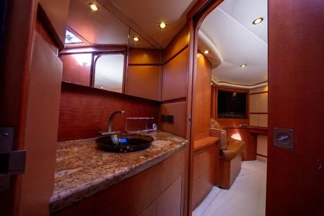  Yacht Photos Pics Luxurious 1997 Garlington Convertible yacht interior with elegant wood finishes and modern amenities.