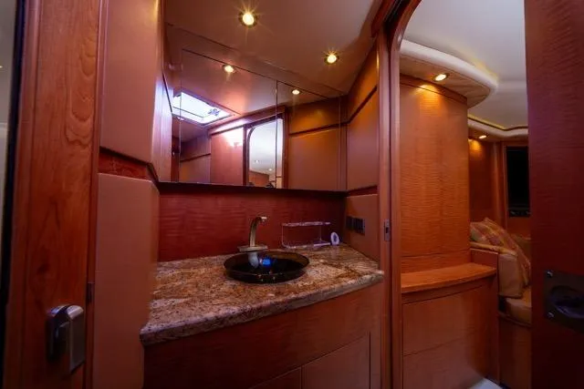  Yacht Photos Pics Luxurious 1997 Garlington Convertible yacht interior with elegant wood finish and granite countertop.