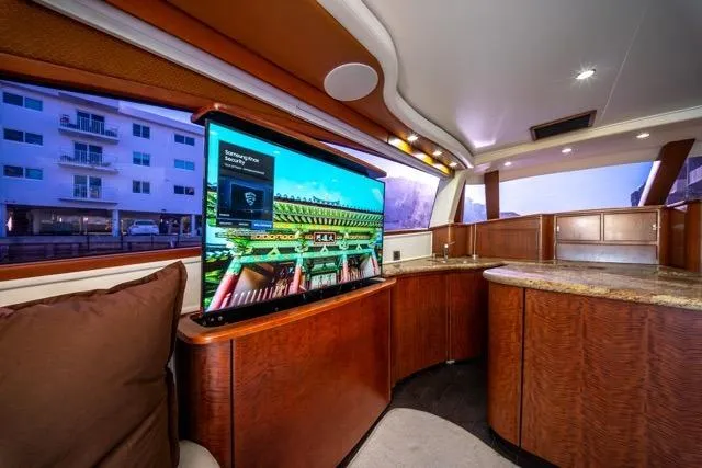  Yacht Photos Pics Luxurious interior of a 1997 Garlington Convertible yacht with modern amenities and elegant wood finishes.