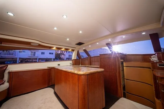  Yacht Photos Pics Luxurious interior of a 1997 Garlington Convertible yacht with elegant wood finishes.
