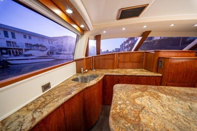  Yacht Photos Pics Luxurious 1997 Garlington Convertible yacht interior with elegant wood and granite finishes.