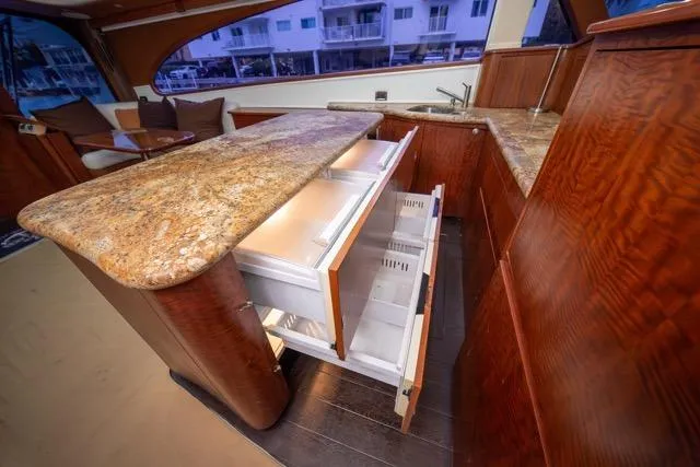  Yacht Photos Pics Luxurious 1997 Garlington Convertible yacht interior with elegant wood cabinetry and granite countertops.