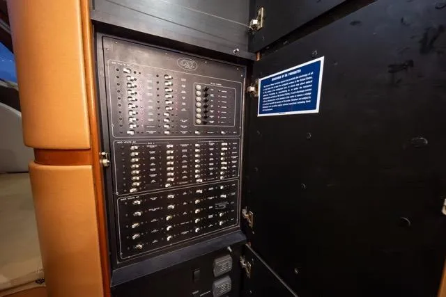  Yacht Photos Pics Electrical panel inside a 1997 Garlington Convertible, showcasing switches and controls.