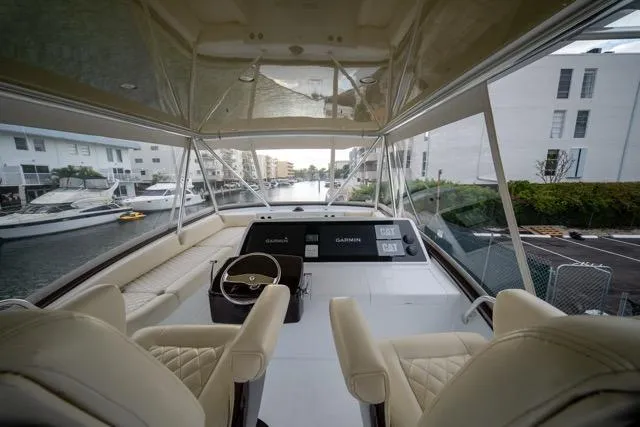  Yacht Photos Pics Interior view of a 1997 Garlington Convertible yacht with luxurious seating and modern controls.