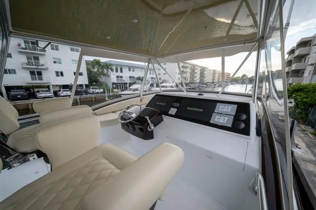  Yacht Photos Pics 1997 Garlington Convertible yacht interior with beige seating and modern navigation equipment.