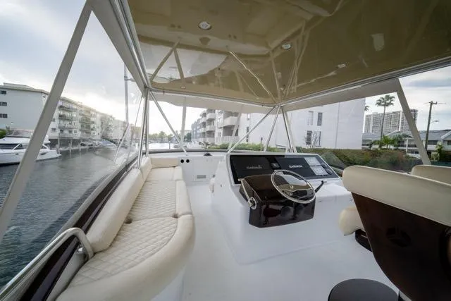  Yacht Photos Pics 1997 Garlington Convertible yacht interior with helm, seating, and waterfront view.