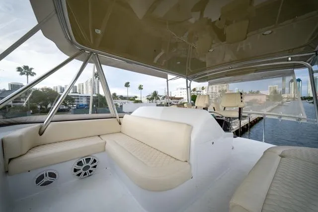  Yacht Photos Pics 1997 Garlington Convertible yacht interior with beige seating and waterfront view.